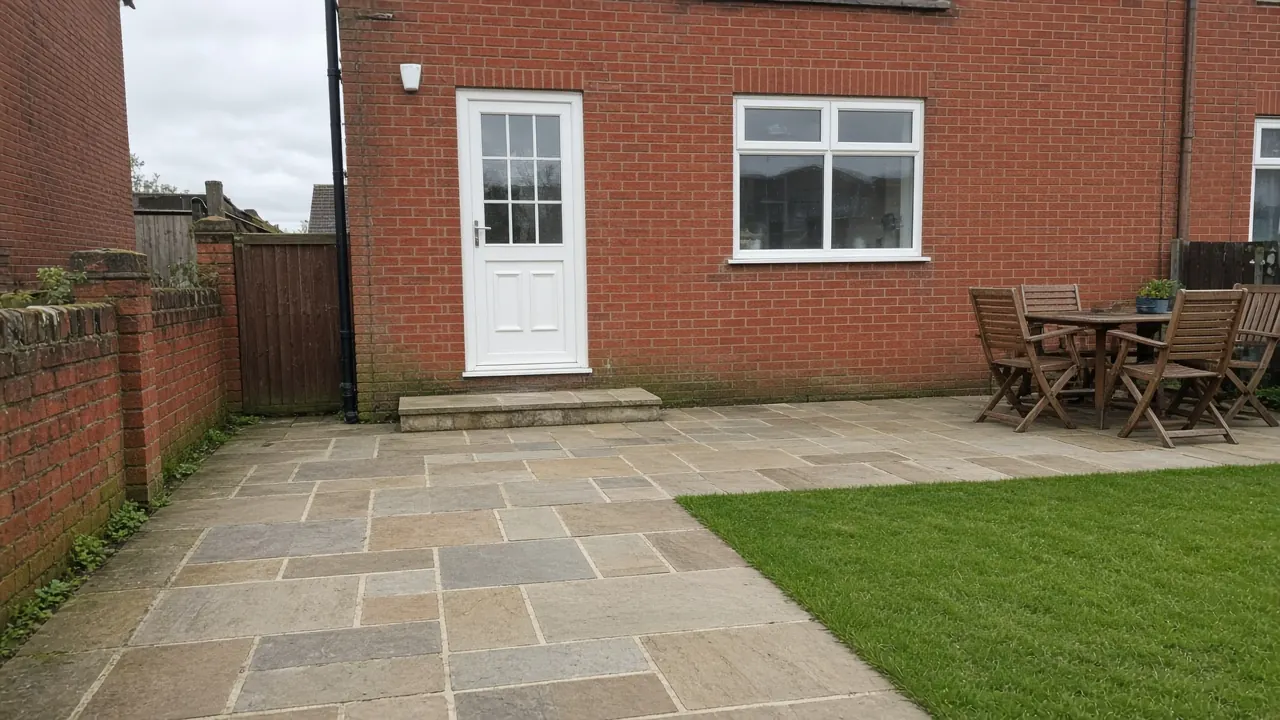 Example image of an Indian sandstone patio behind a red-brick house, as often laid in Stokesley